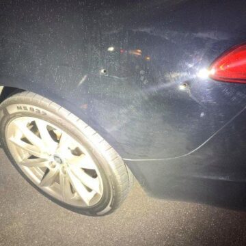 MOTORIST CRASHES AFTER BEING SHOT AT