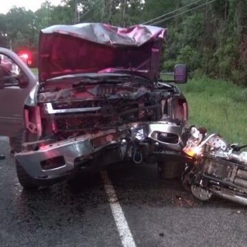 Motorcyclist killed, passenger injured after head-on crash with truck carrying tree debris