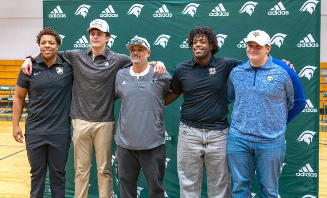 Four Woodlands Christian Academy Football Athletes celebrate Signing Day